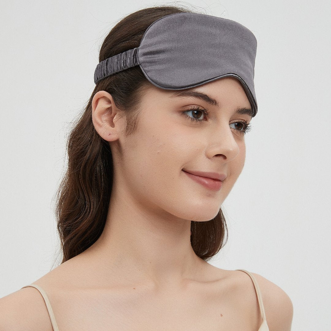 Mari Ann champagne silk sleep mask with an elastic band for a comfortable, secure fit, providing luxurious softness and restful sleep.
