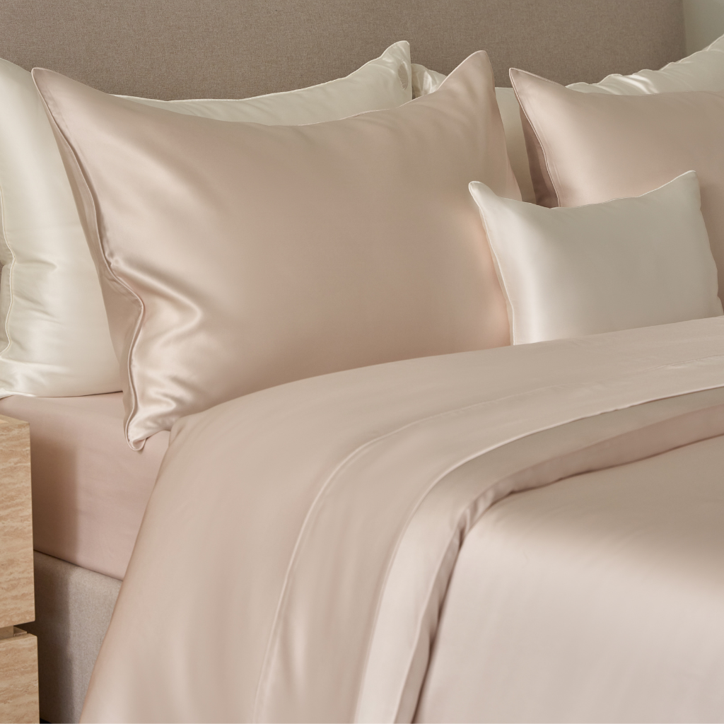 close-up of Perle light pink/
blush silk bedding set crafted from 22 momme pure mulberry silk