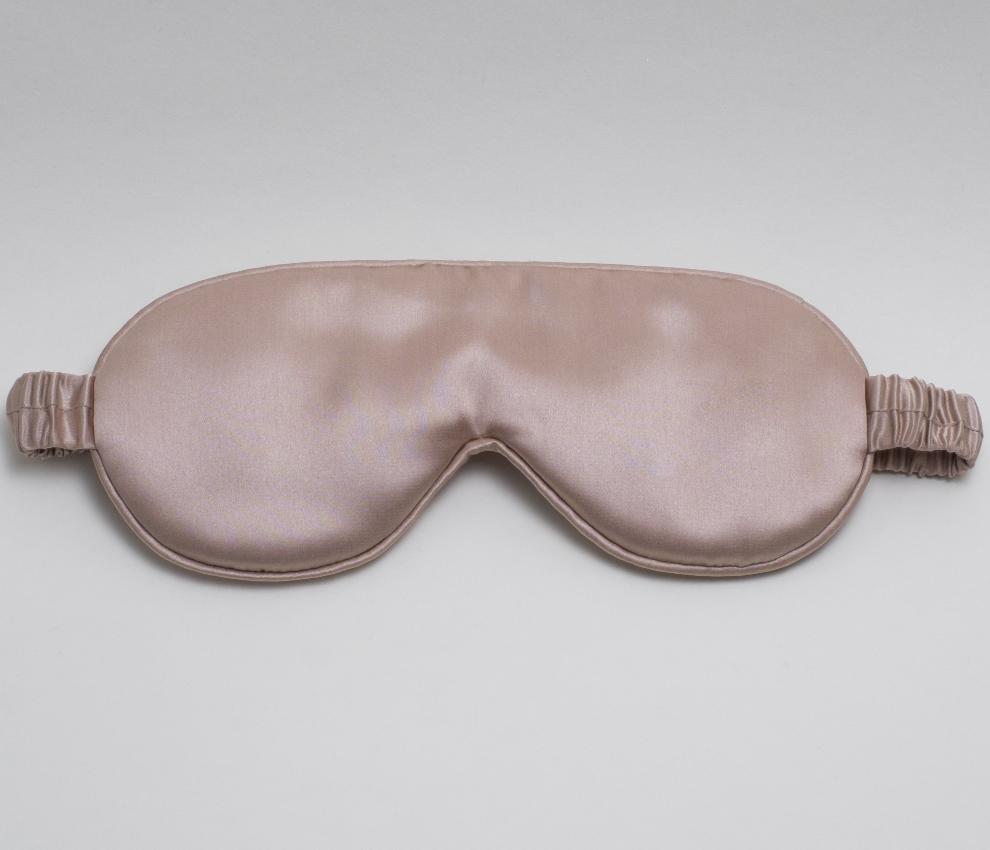 Mari Ann silk sleep mask in brass color, crafted from ultra-soft and smooth silk, offering luxurious comfort and a perfect fit for restful sleep.