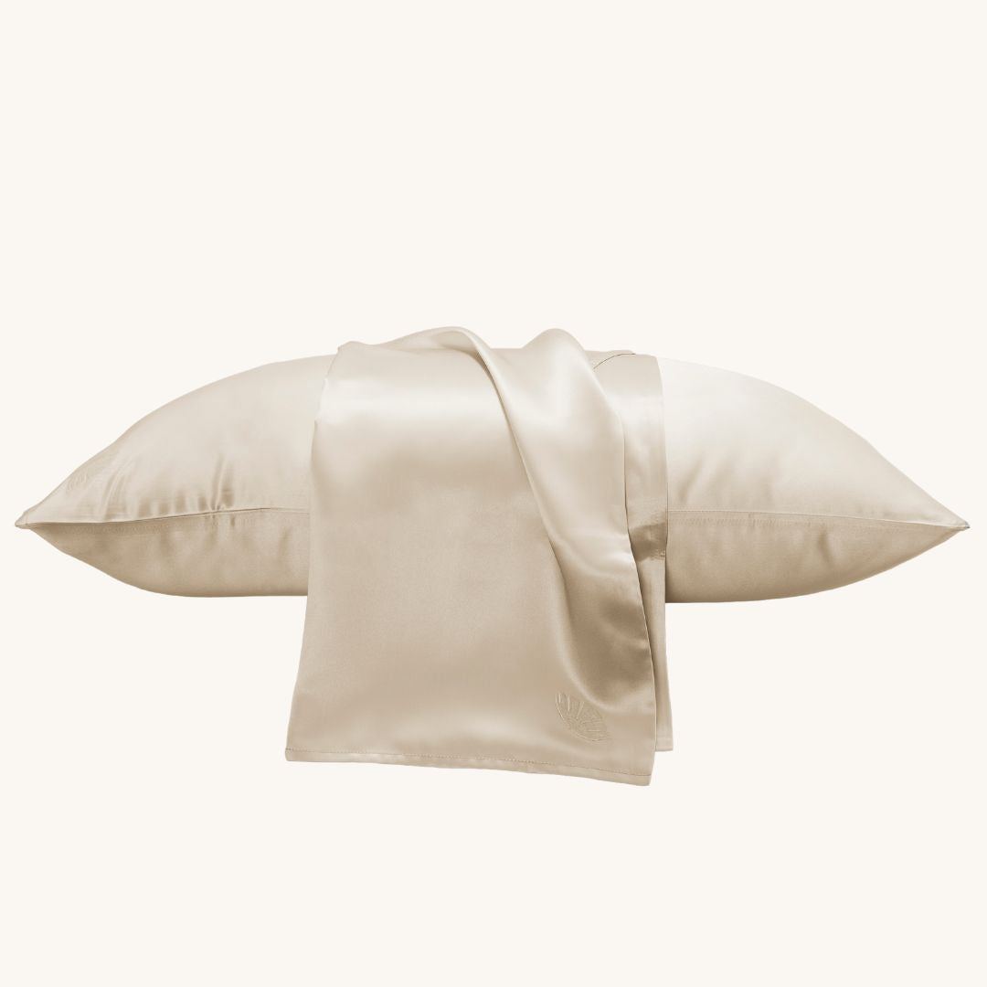 Luxury silk pillowcase with intricate embroidery, made from 100% mulberry silk, offering a soft, smooth feel for a restful night's sleep while adding an elegant touch to your bedroom decor.