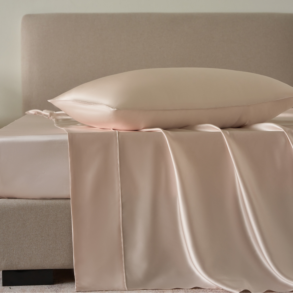 close-up of Perle light pink silk flat sheet crafted from 22 momme pure mulberry silk